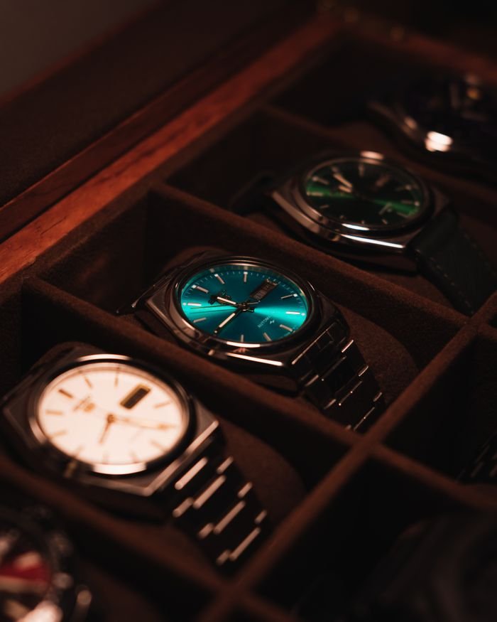 Mastering the First Impression: Your intriguing post title goes here Showcase of elegant luxury watches in a display case with warm lighting.
